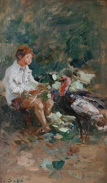 A young boy with two turkeys