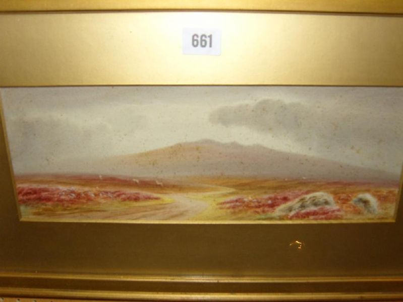 A moorland landscape with sheep grazing