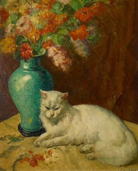 White cat by a vase of flowers