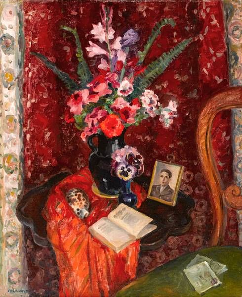 Tabletop still life with flowers and a photograph